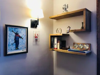 a room with shelves and a painting of a soldier at Sunside Oak - 206 in Kopaonik