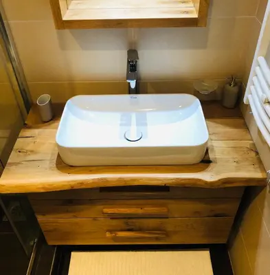 a white sink on a wooden counter in a bathroom at Sunside Oak - 206 in Kopaonik