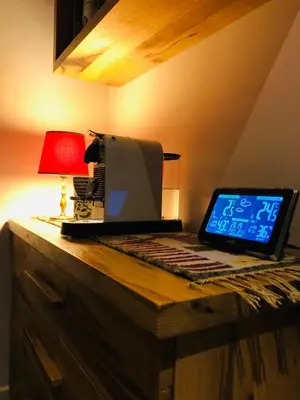 a laptop computer sitting on top of a wooden desk at Sunside Oak - 206 in Kopaonik