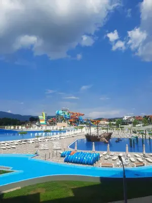 a large swimming pool with a water park at Bankovic Apartman in Vrnjačka Banja