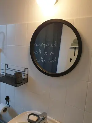 a bathroom with a mirror and a sink at Apartman Park Jagodina-studio u centru grada FREE parking in Jagodina