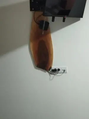 a guitar hanging on a wall at Lela Kop in Kopaonik