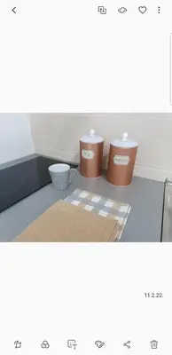 two containers sitting on top of a kitchen counter at IN Apartmani in Kruševac