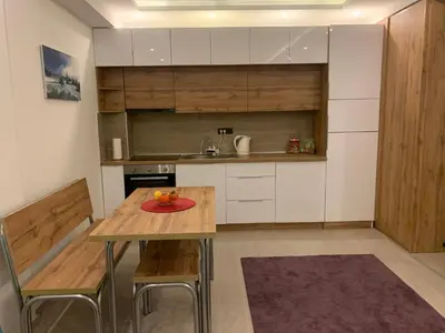 a kitchen with a table with a plate on it at Milmari Resort N73 Ski & Spa in Kopaonik