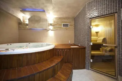 a large bathroom with a tub and a shower at MK Apartments Zoned 2 Spa&Wellness in Cajetina