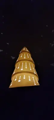 a gold object with lights on a black background at Apartman Paunovi Čardaci sa garažnim mestom in Kopaonik