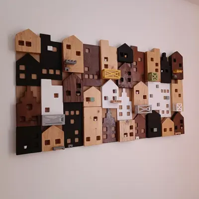 a collage of cardboard buildings on a wall at Apartman Paunovi Čardaci sa garažnim mestom in Kopaonik