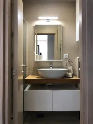 a bathroom with a sink and a mirror at Vila Montana Kopaonik Apartman 6 in Kopaonik