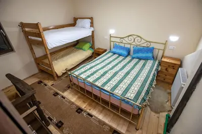 an overhead view of a bedroom with two bunk beds at Apartmani SP Jovanovic in Crni Vrh