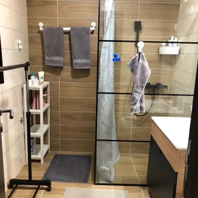 a shower with a glass door in a bathroom at Apartman 217 in Kopaonik