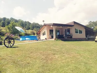 a house with a large yard in front of it at 