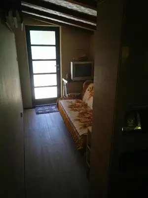 a bedroom with a bed and a door with a window at 