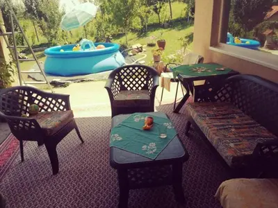 a living room with a couch and a table and a pool at 