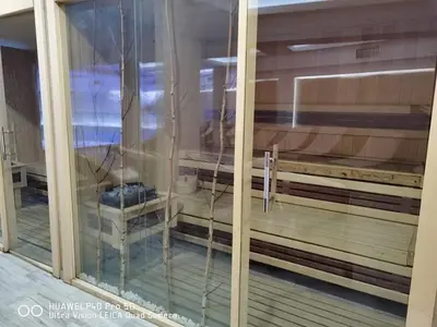 a view of a room through a glass window at Studio apartman p13 in Kopaonik