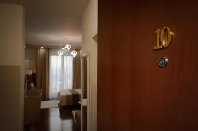 a room with a door with the number on it at Apartman In Lux in Vrnjačka Banja