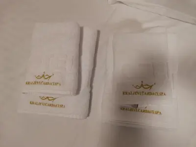 two towels sitting on top of a bed at JORDAN Apartment KC 9C 35 Kopaonik in Kopaonik