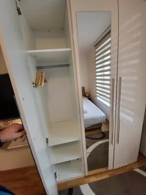 a room with a closet with shelves and a bed at JORDAN Apartment KC 9C 35 Kopaonik in Kopaonik