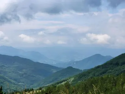 a view of a valley with mountains in the distance at JORDAN Apartment KC 9C 35 Kopaonik in Kopaonik