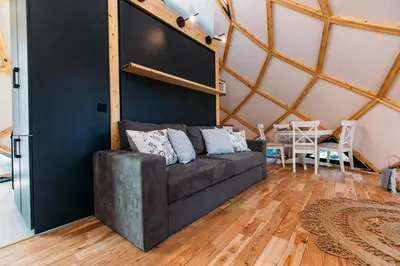a living room with a couch and a table at Armadillo Houses in Kopaonik