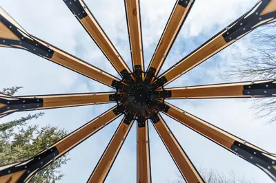 a close up of the top of a wooden umbrella at Armadillo Houses in Kopaonik