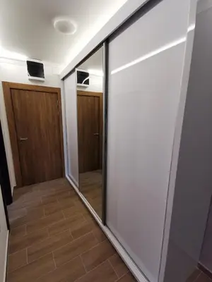 a sliding glass door in a room with a hallway at Suncana planina apartman 103 in Kopaonik