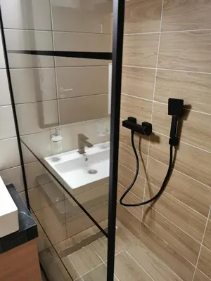 a bathroom with a sink and a faucet at Suncana planina apartman 103 in Kopaonik