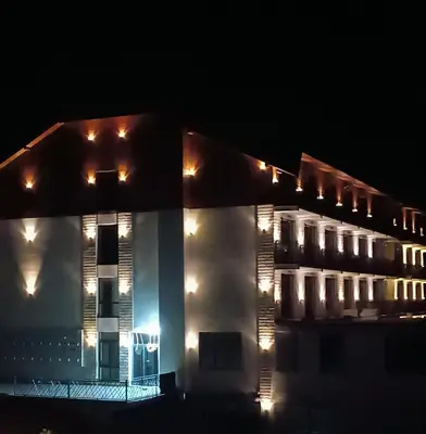 a lit up building at night with lights at President KOP A515 in Kopaonik