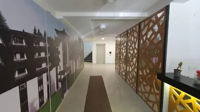 a hallway with a wall with art on it at Vili.Kop studio in Kopaonik