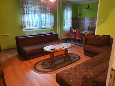 a living room with a couch and a coffee table at Smestaj Boki in Soko Banja