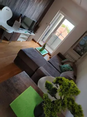 an aerial view of a living room with a couch at APARTMAN ANA in Niš