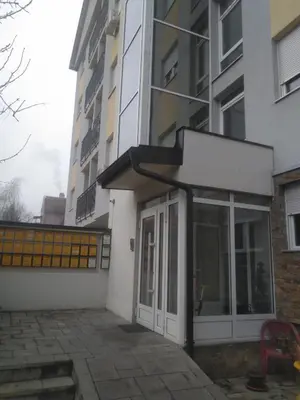 an entrance to a building with a glass door at Apartman Mihajlovic in Soko Banja
