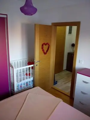 a room with a door with a heart hanging on it at Apartman Mihajlovic in Soko Banja