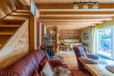 a living room with couches and a dining room at Villa Teodora in Kopaonik