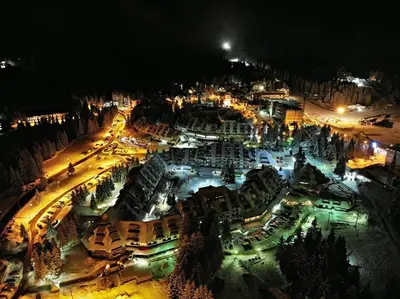 an aerial view of a city at night at Apartmani A in Kopaonik