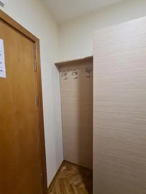 a closet with three hooks on the wall at Happy Moments in Vrnjačka Banja
