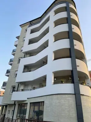 a tall apartment building with people on the balconies at DREAM house in Paraćin