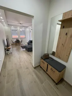 a living room with a couch and a table at DREAM house in Paraćin