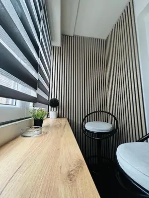 a room with a wooden table and a chair at Apartman Bonaca in Niš