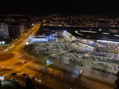 an aerial view of a parking lot at night at Apartman Bonaca in Niš