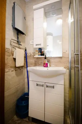 a bathroom with a white sink and a shower at Apartman Pašajlić in Vrnjačka Banja