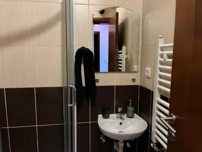 a bathroom with a sink and a mirror at STUDIO DJORDJO in Kruševac