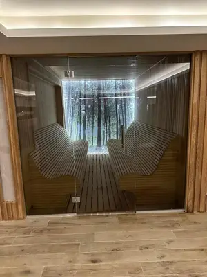 a reflection of a room with stairs in a building at Milmari Resort N56 Kopaonik wellnes&spa in Kopaonik