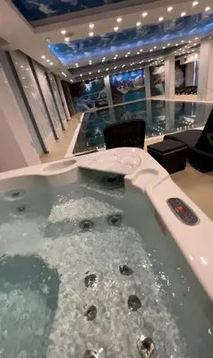 a jacuzzi tub in the middle of a room at PresidentKop LUX Wellness & SPA Apartments in Kopaonik