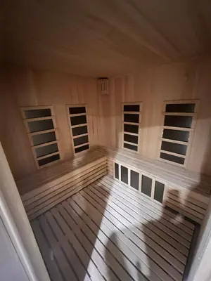 an empty cabin with wooden floors and windows at PresidentKop LUX Wellness & SPA Apartments in Kopaonik