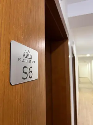 a sign on a door that says president at PresidentKop LUX Wellness & SPA Apartments in Kopaonik