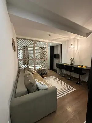 a living room with a couch and a pool table at PresidentKop LUX Wellness & SPA Apartments in Kopaonik