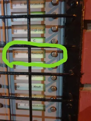 a green ribbon on a stack of books at City center apartment 2 in Niš