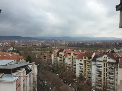 a view of a city with buildings and cars at City center apartment 2 in Niš