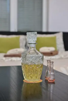 a glass vase sitting on top of a table at Studio apartman Zvezdana Noć in Vrnjačka Banja