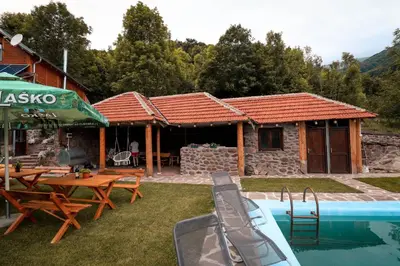 a house with a swimming pool next to a building at Jaćimov Konak in Pirot